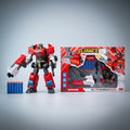 Transforming robot figure with dart launchers beside its window box and blue darts