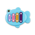 Fish-shaped four-key toy xylophone viewed from above on white background