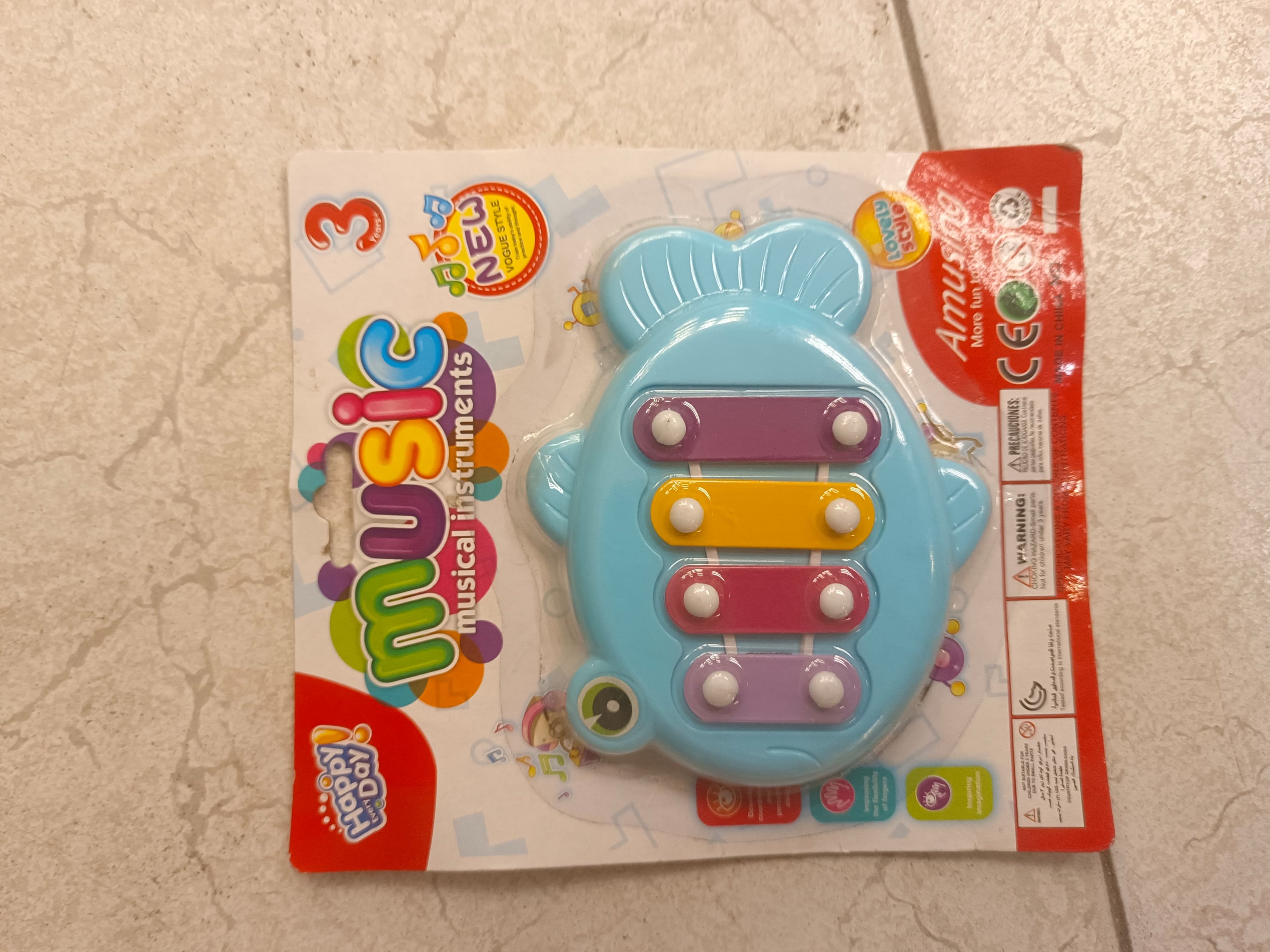 Fish xylophone sealed on its printed blister card