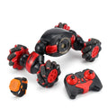 RC stunt car with gesture wristband and twin-stick remote on white background